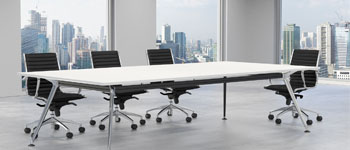Modern conference room with a long table and chairs.